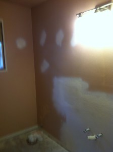 Patching the walls before the paint goes on.